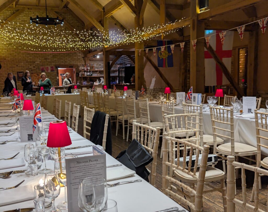 Trafalgar Night 2026 image of the inside of barn set up for Trafalgar Night Dinner